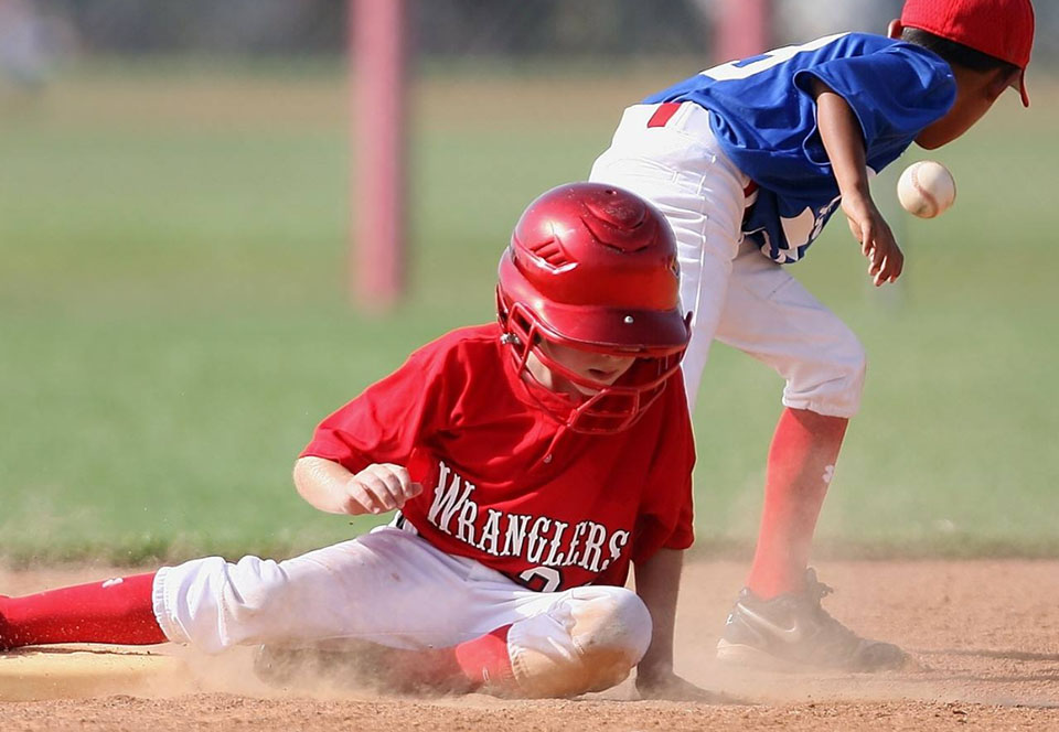 Running slides into the base