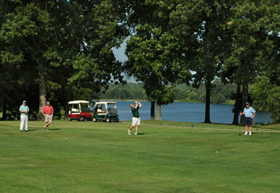 Golfers teeing off